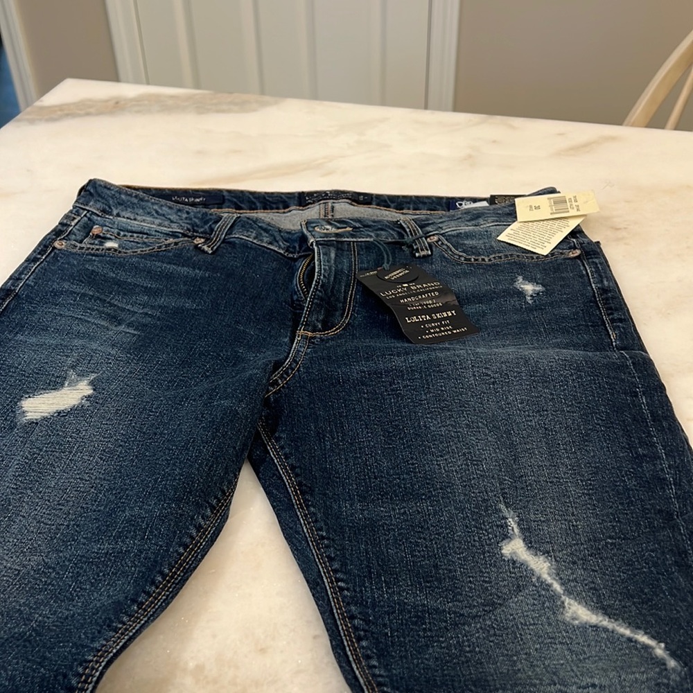 Dark blue Brand skinny jeans. Size 10. New w/ tags. Slight distressing & fraying